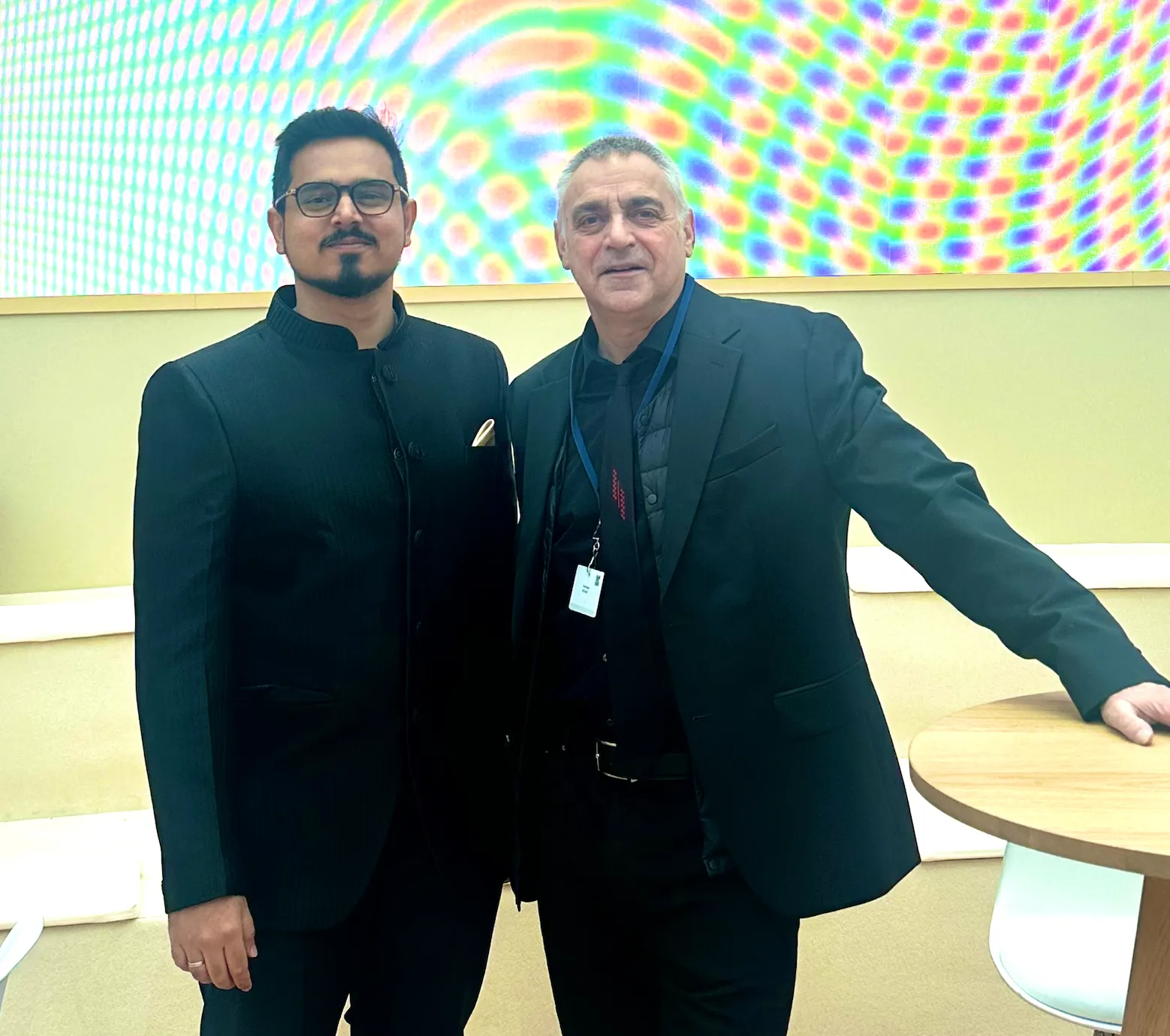 Fabin Rasheed with curator Dominique Moulon at Art Dubai 2025, alongside consciousness artwork O